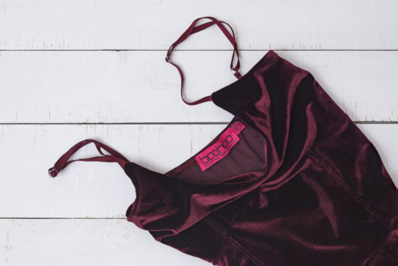 Burgundy Bodysuit on a table