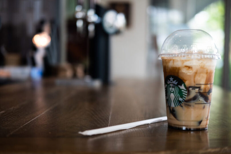Iced Brown Sugar Oatmilk Shaken Espresso drink sitting on a table at Starbucks