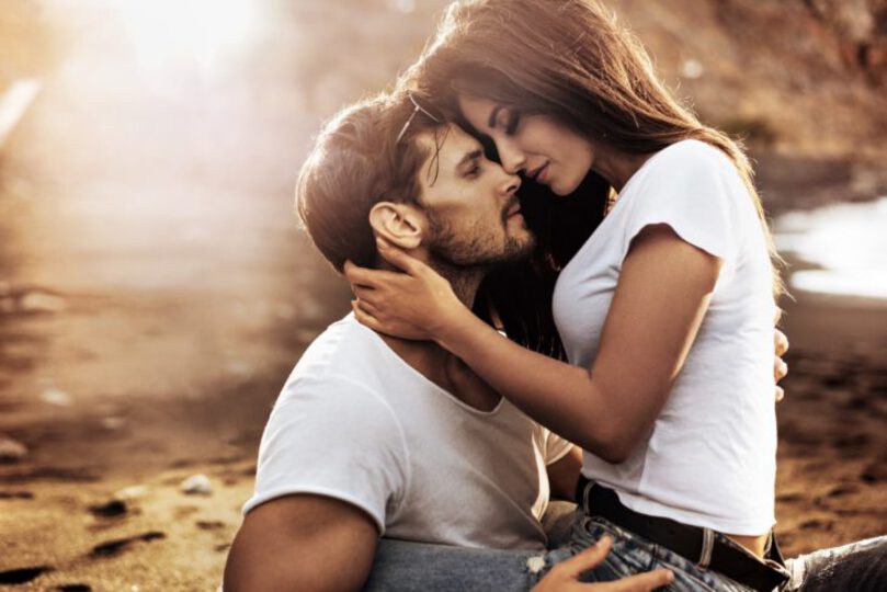 Man and woman hugging each other intimately