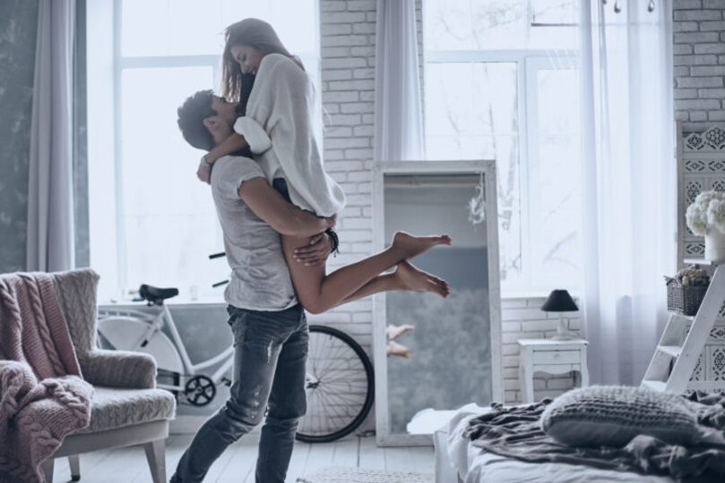 Man picking up his girlfriend