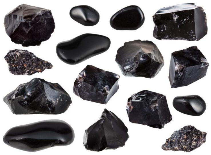 Line-up of black obsidian stones