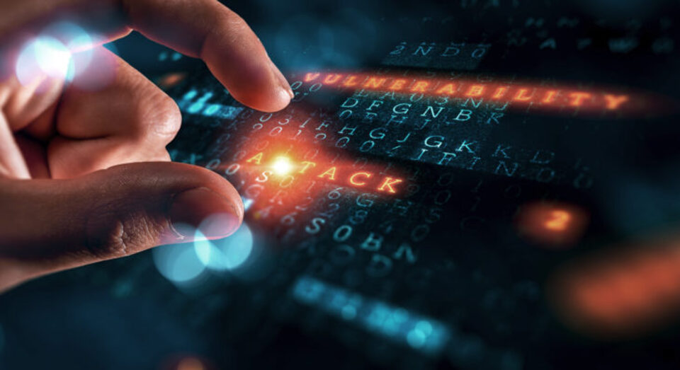 A hand person on a lit-up computer keyboarx