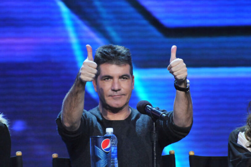 Simon Cowell giving a thumbs-up at "X-Factor"