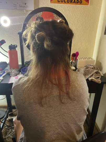 sectioned hair, sitting up, looking at the back of hair
