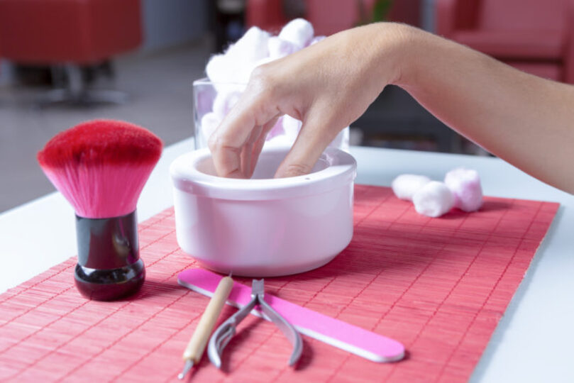 nails soaking in nail polish remover
