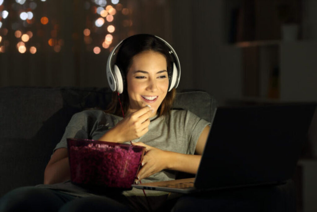 Woman watching a film on her laptop