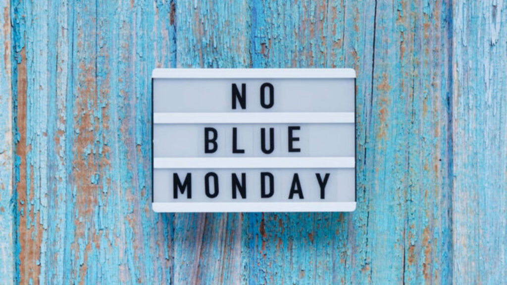 Blue Background with a light up sign box saying No Blue Monday